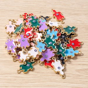 Detail of colorful turtle charms with evil eye pattern for DIY jewelry and crafts