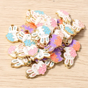 Macro view of colorful enamel rabbit charms for DIY jewelry and accessory making