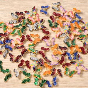 Colorful enamel butterfly charms for jewelry making in various vibrant metallic finishes