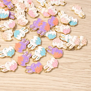 Detail of cartoon bunny charms with colorful drip oil finish for DIY jewelry crafting