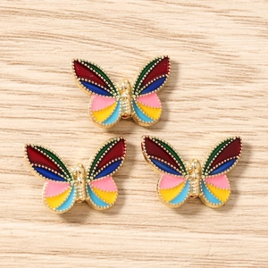 Detail shot of colorful butterfly enamel charms for DIY jewelry and accessory making
