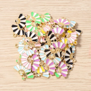Macro shot of colorful enamel folding fan pendants made of alloy for DIY jewelry making
