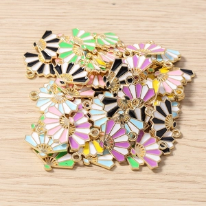 Colorful fan-shaped enamel alloy pendants for DIY jewelry making on wood background
