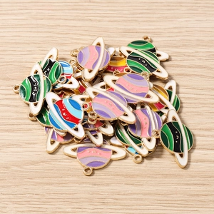 Detail of colorful enamel globe charms with alloy base for DIY jewelry making