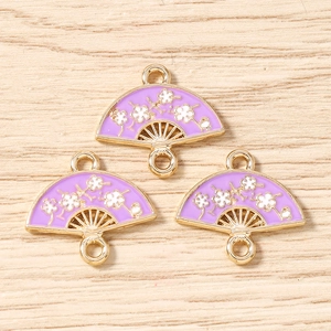 Detail of fan-shaped purple enamel flower pendants for DIY jewelry making accessories