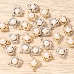 Detailed view of geometric square pearl charms with sparkling rhinestones for DIY jewelry