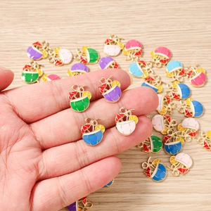 Macro shot of colorful enamel coconut drink charms with sunshades for DIY jewelry making