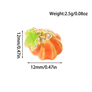 Detail view showing 12mm orange enamel pumpkin charm for DIY jewelry with size and weight specs