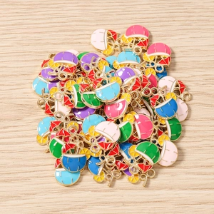 Macro view of assorted enamel coconut drink charms with gold plating for jewelry making