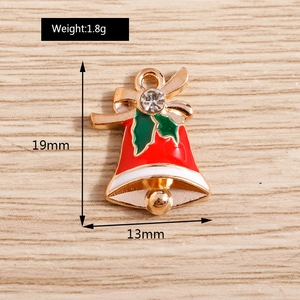 Detail of Christmas bell pendant with red enamel, gold finish and size measurements
