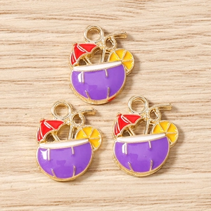 Macro detail of tropical cocktail charms with enamel colors for DIY jewelry making