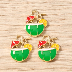Detailed macro of tropical coconut drink charms with colorful enamel and golden frame
