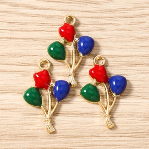 Detailed macro view of three colorful enamel balloon pendants for DIY jewelry making