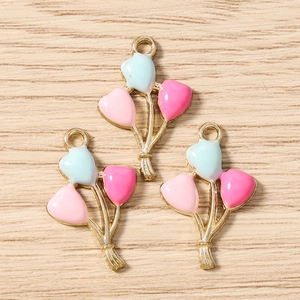 Detailed macro view of colorful enamel balloon bouquet charms for DIY jewelry making