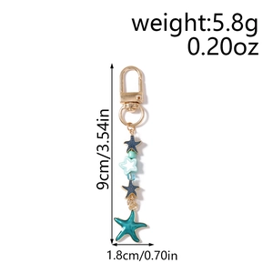 Starfish keychain dimensions with weights showing gold metal ring and enamel charms
