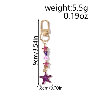 Detailed view of starfish keychain dimensions 9cm by 1.8cm with gold lobster clasp