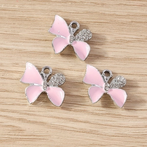 Pink enamel butterfly pendant set with sparkling rhinestones and silver metal loop for DIY