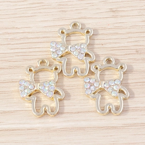 Set of three cute cartoon bear pendants with gold hollow frames and rhinestone bowknots