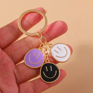 Three-color enamel smiley face keychain charms with golden metal ring for bag decoration