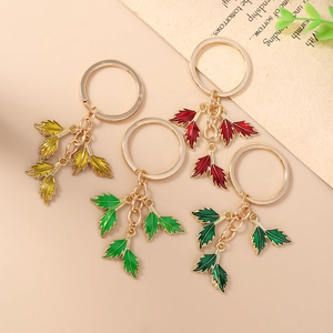 Fashionable enamel leaf keychain set in four vibrant colors with gold metal keyring