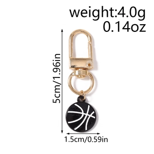 Detail view of gold basketball keychain showing size 5cm and weight 4.0g on white background