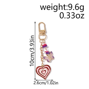 Detail view of heart and butterfly keychain with 10cm length and 2.6cm width dimensions