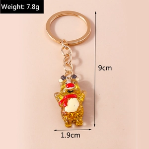 Detail showing amber resin reindeer bear keychain size 9cm length and 7.8g weight