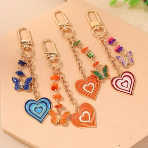 Set of 4 bohemian alloy keychains with colorful stones, enamel butterflies and hearts
