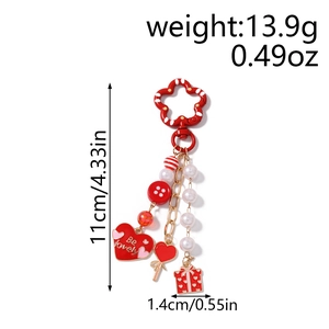 Detailed view of beaded lip keychain with weight and size labels on white background