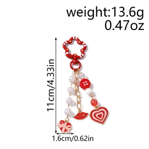 Detailed view of Kiss Me lip and heart charms with beads showing 11cm length dimensions
