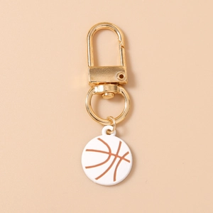 Detailed close-up of a white basketball keychain charm with a golden lobster clasp
