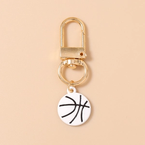 Detailed view of sports basketball keychain with golden clasp and white enamel basketball pendant