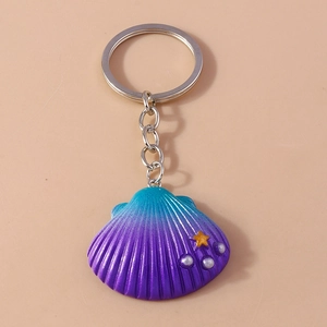 Detail of gradient seashell keychain with starfish accent and silver metal ring