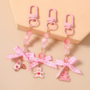 Pink beaded heart keychain set with fabric bows and cute bear love pendants