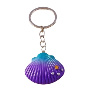 Shell keychain featuring a blue to purple gradient finish with star and pearl accents