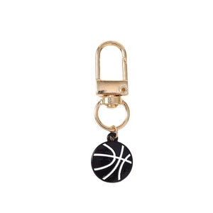 Gold basketball keychain with a black and white enamel ball pendant for sports enthusiasts