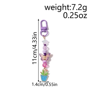 Porte-clés perles mauves avec papillon et cactus, dimensions de 11 cm x 1,4 cm environ