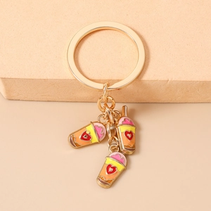 Detail of fashion gold keychain with cute heart milk tea enamel drink pendants