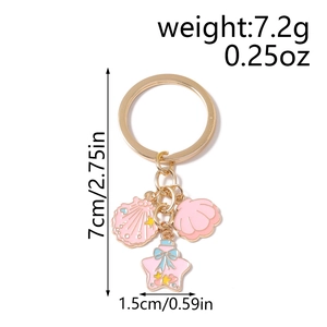 Detailed view of pink enamel starfish and shell charms with exact size measurements