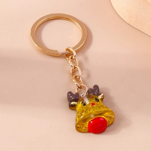 Detail of Christmas reindeer keychain with golden glitter filling and metallic ring