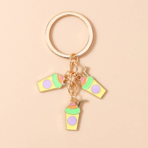 Detail of golden keychain with three colorful enamel summer drink cup pendants