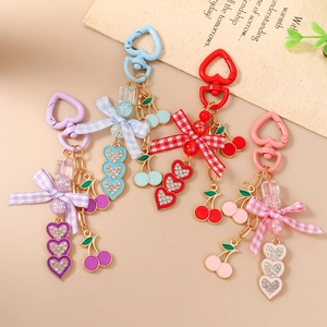 Fashionable cherry and bow heart keychains in four colors for handbags and accessories