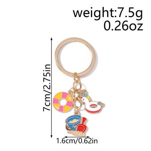 Detail view of beach theme keychain with starfish, unicorn and bucket charms