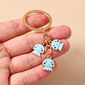 Simpatico portachiavi a forma di medusa blu con anello in metallo dorato e smalto