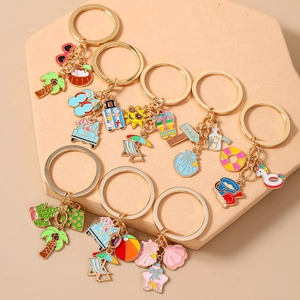 7-piece set of summer beach keychains with starfish, shell, and palm tree charms