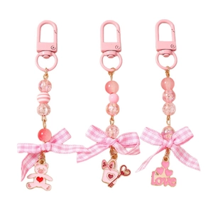 Pink heart bear and bow bead keychain set with love charms on white background