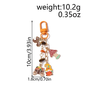 Detail of fall squirrel and pumpkin gnome keychain with size and weight dimensions