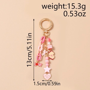 Detail of pink beaded star keychain with LOVE charm and heart pendant for bag accessory