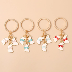 Porte-Clés Lapin Mignon Avec Nœud Papillon Trois Charmes de Lapin en Alliage de Zinc Or pour Femmes Pendentif de Sac Bijoux Cadeau