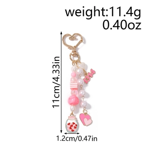 Detail of pink and white beaded keychain with heart charms and dimensions markings